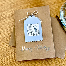 A handmade birthday card with a gardening theme