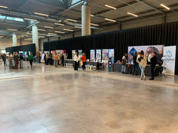 An indoor trade show with multiple booths, banners, and promotional materials. People interact with exhibitors in a well-lit space featuring a high ceiling, exposed pipes, and a polished concrete floor. Various companies display their branding and products.
Tags:
Trade Show
Exhibition
Industrial Design
Event Space
Booths
Promotional Materials
High Ceiling
Exposed Pipes
Concrete Floor
Brand Displays