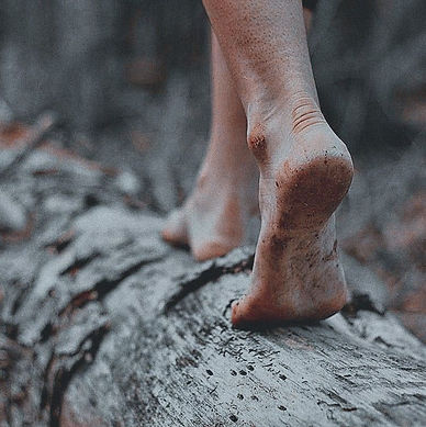 woman walking barefoot in nature