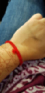 A common blessing idea, prayer band corn from the web of support in ceremony, red for protection, each time you see it on your wrist you will be reminded of the birthing parent and send love and prayers.