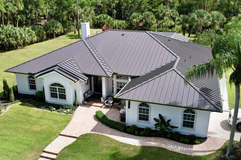 This home in Palm Beach Gardens, FL has a 24 gauge, 1.5 inch standing seam mechanically locked metal roof. The color of this metal roof is Dark Bronze.