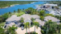 Luxury home in Jupiter, FL featuring a new barrel tile roof installed by Legacy Contracting Solutions