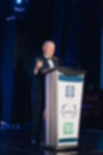 Robert Bedard addresses the audience from the podium after receiving his award.