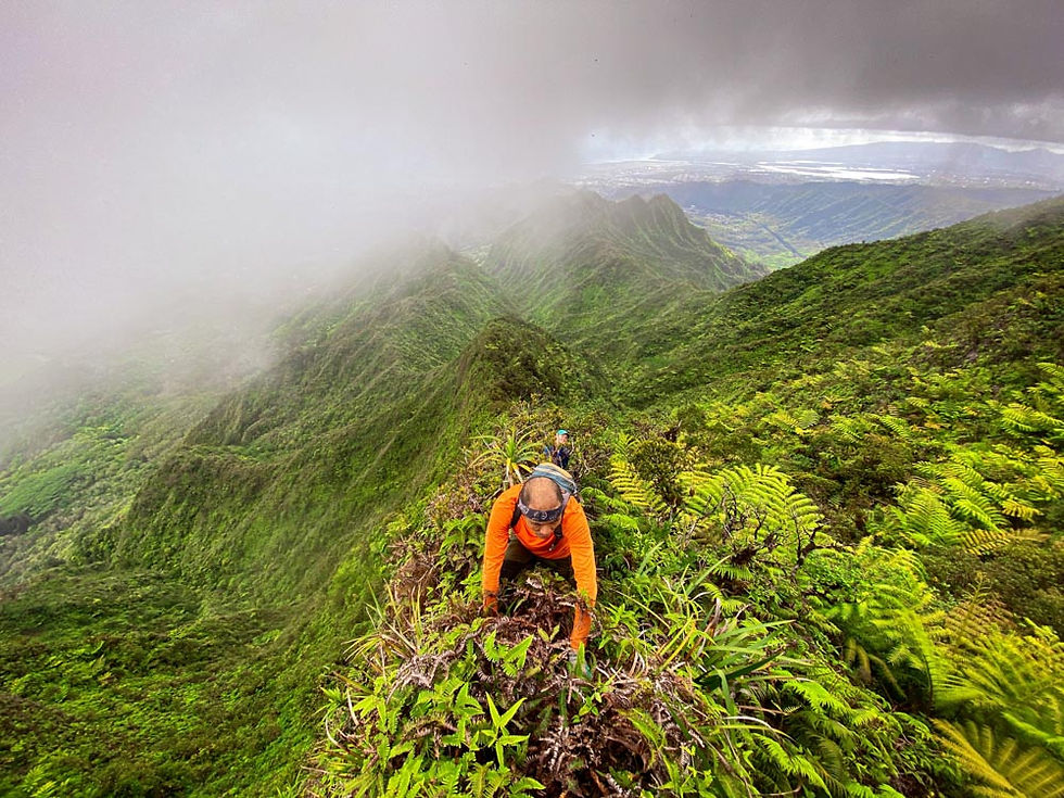 hiker on narrow ridge