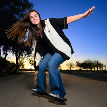 Madi, a high school senior grad, rides on her ripstick in Gilbert, Arizona.