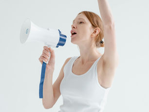 Women shouting through a megaphone trying to get authority on a project