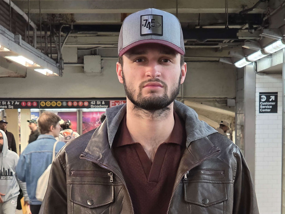 Ian Bruckner standing in NYC subway station