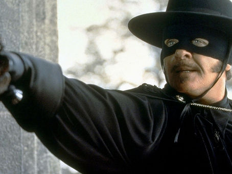 Masked Zorro in black attire and a wide-brimmed hat from The Mask of Zorro (1998).