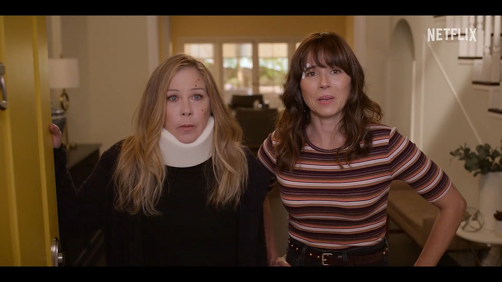 Jen and Judy from Dead to Me looking shocked.