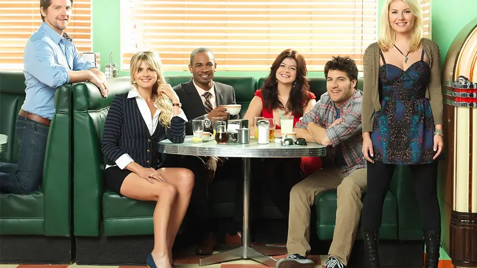 The Happy Endings friends gather around a diner booth and table.