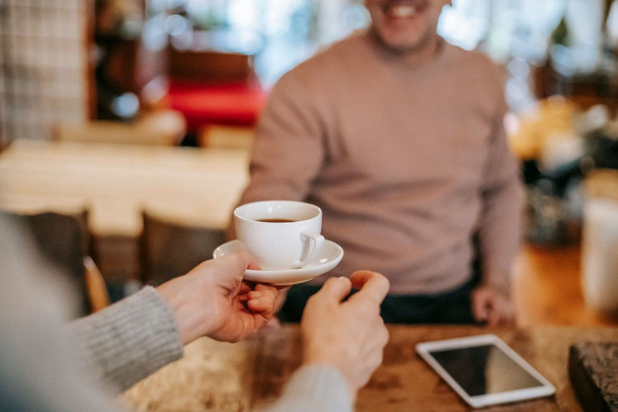 Couple enjoying coffee together at breakfast