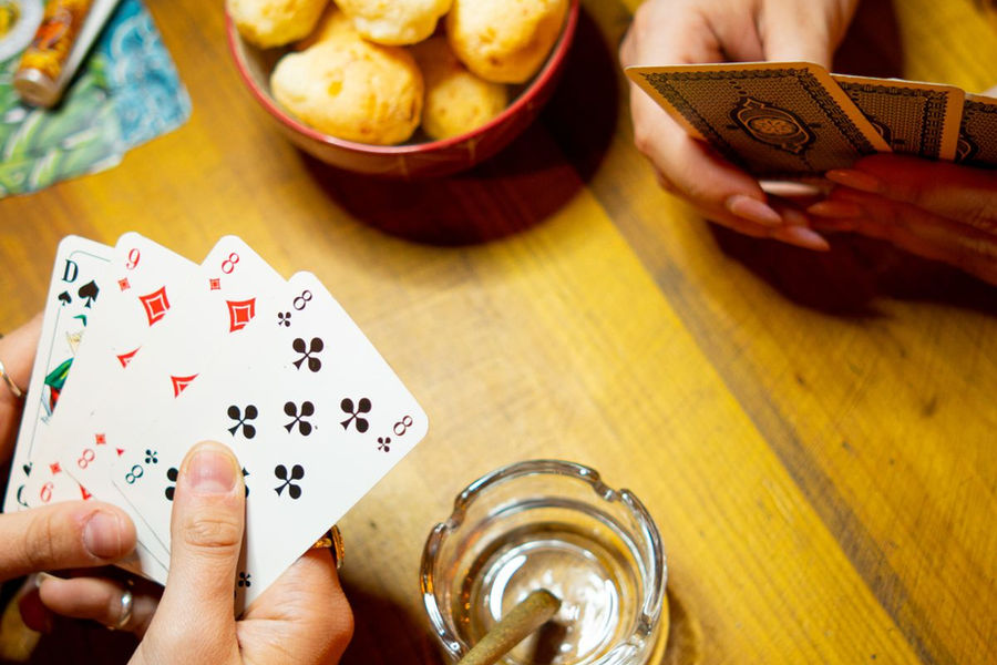 Friends sharing a card game around a table