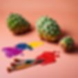 prickly pear cactus with paint brushes next to it and colorful paint spilled around it.jpg