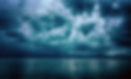 Dramatic stormy dark cloudy sky over sea, natural photo background..jpg