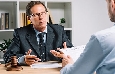 mature-lawyer-discussing-contract-with-client-courtroom_23-2147898420.jpg