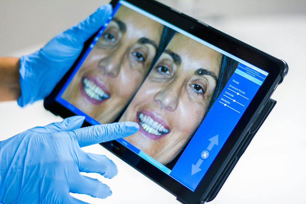 Dentist reviewing before & after smile results on tablet