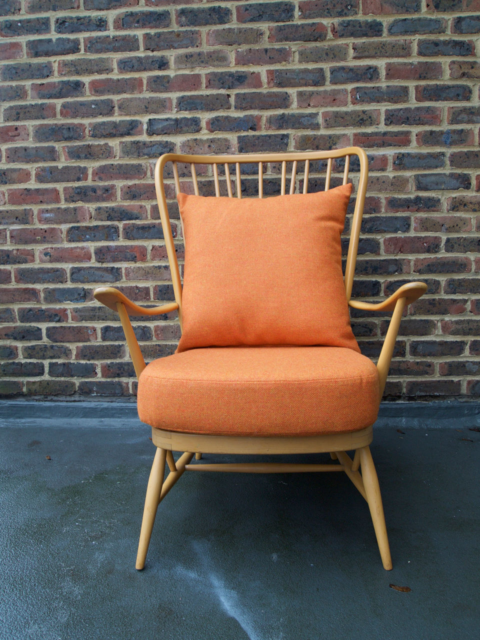 ercol armchair with new seat and scatter cushions