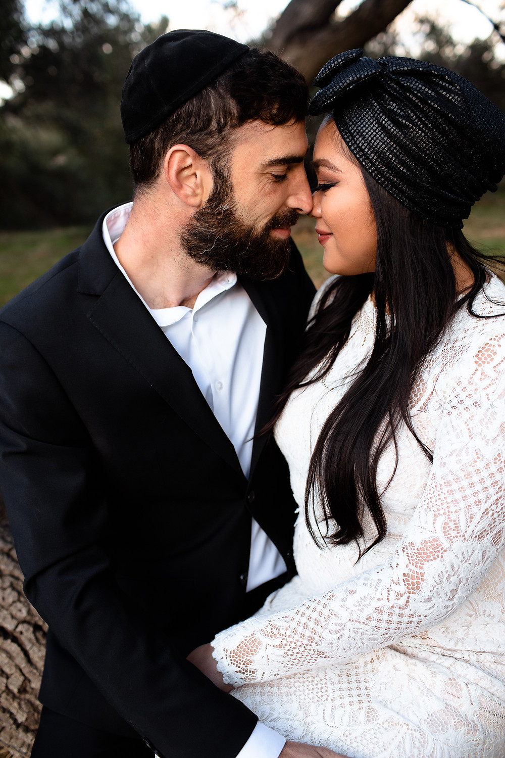 jewish bride and groom nuzzling noses