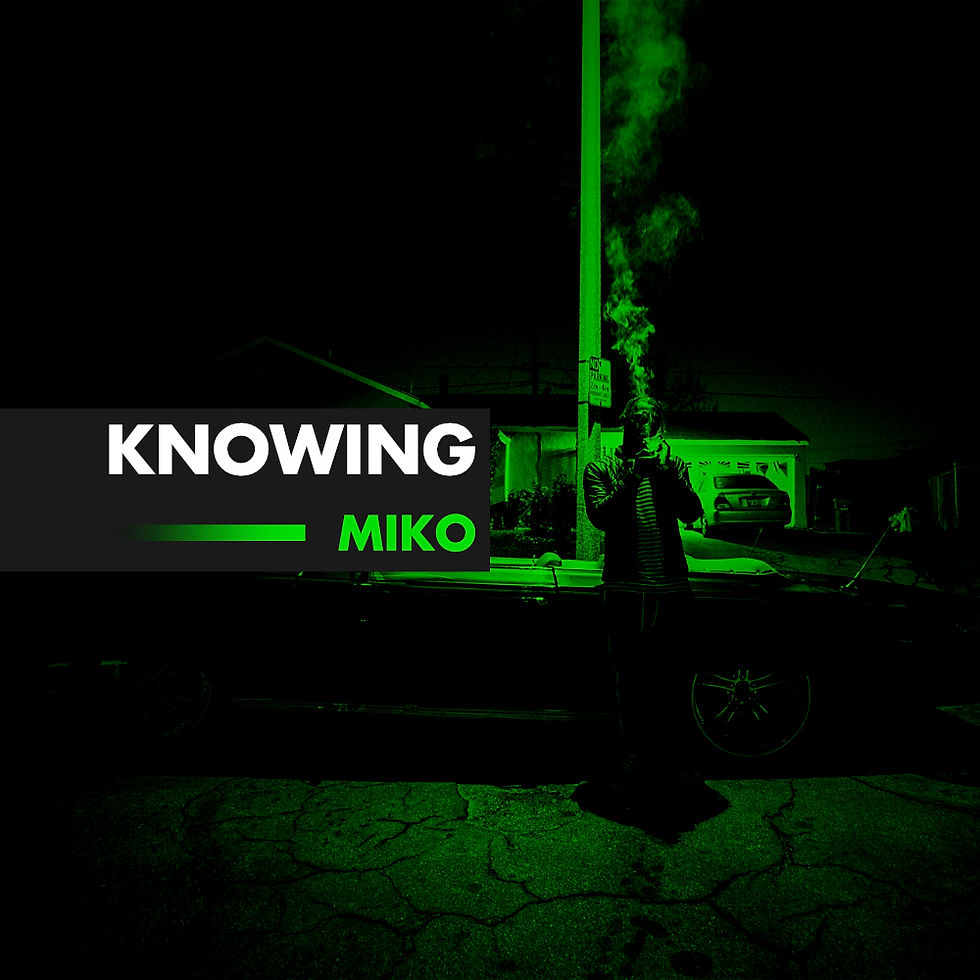 Thumbnail: Album artwork of a man smoking in front of a car in a suburban neighbourhood with a green overlay.