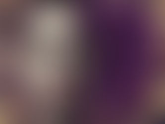 A person with a disgusted expression, furrowed brow, and frown. Purple smoke swirls on a textured, abstract background.