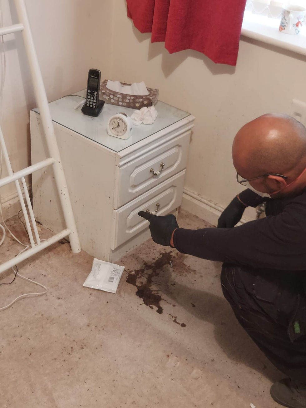 Experienced operator (15 years) evaluating trauma biohazard scene in Wolverhampton