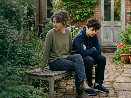 Parent and teenager sitting together at home during the anxious wait for exam results