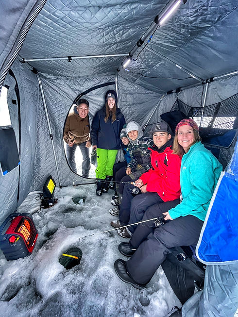 Group in Otter Outdoors fish house.jpeg