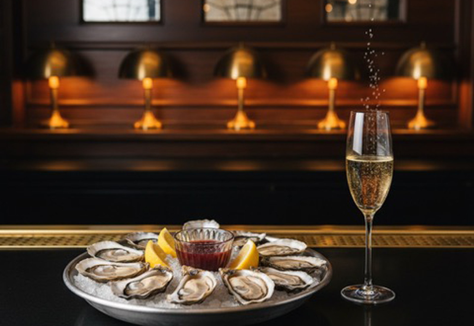 Oysters on ice with a glass of champagne at Twent's