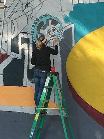 Andrews Avenue Mural - painter on ladder