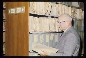 Archivist reviewing folders in the Archives and Special Collections