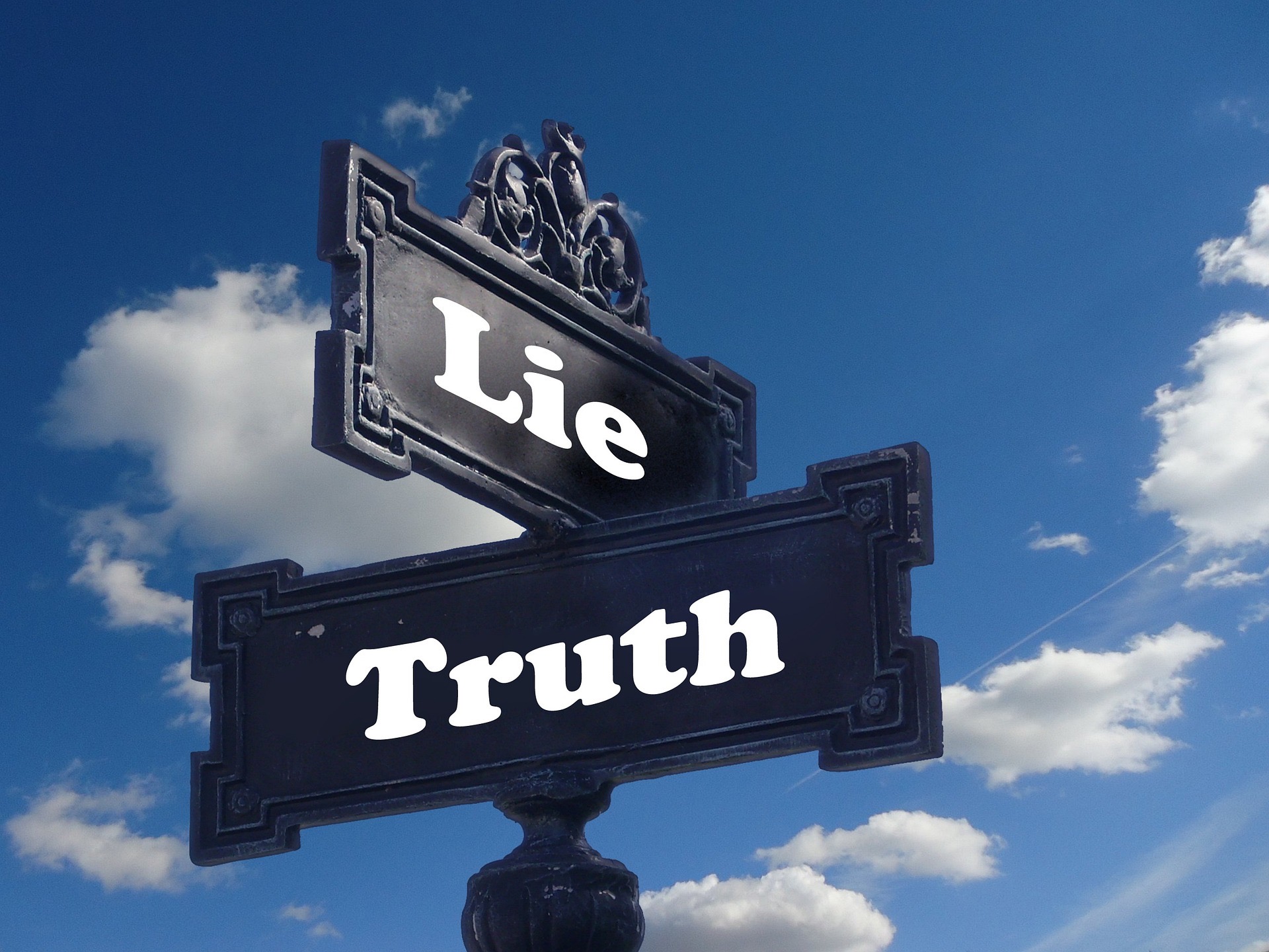 street sign of truth and lies