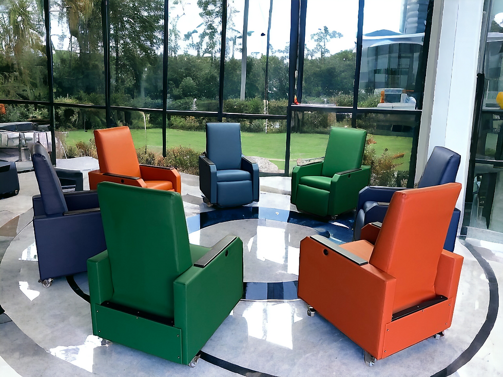 Circle of recliners in multiple colors sitting in a waiting room.