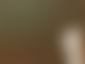 A helping hand in the air holding a lighter with many lights in the background