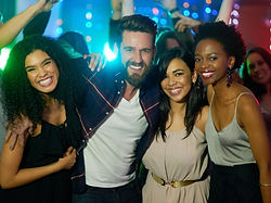going-all-out-this-weekend-portrait-group-smiling-friends-enjoying-eveing-nightclub.jpg