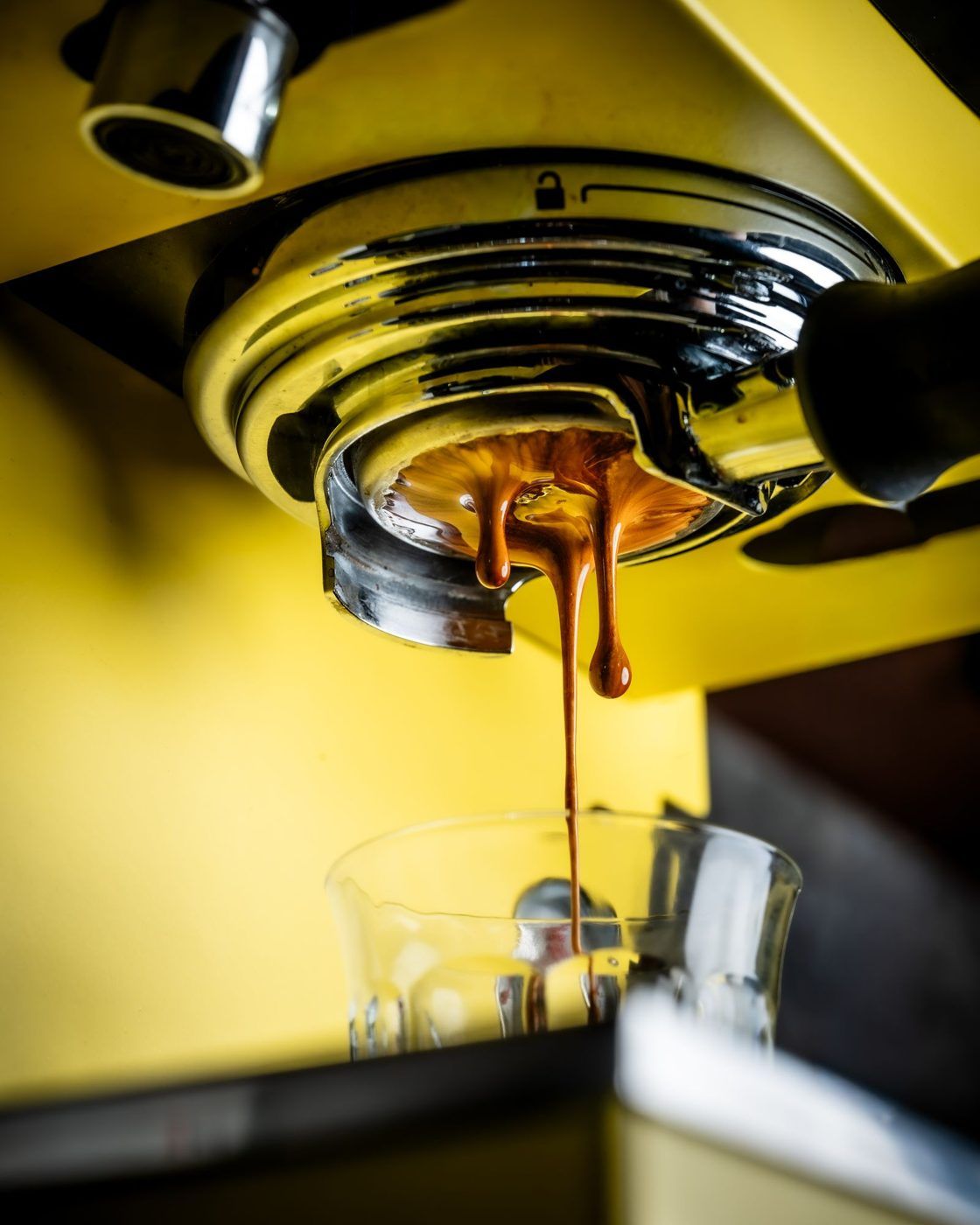 Espresso dripping on yellow