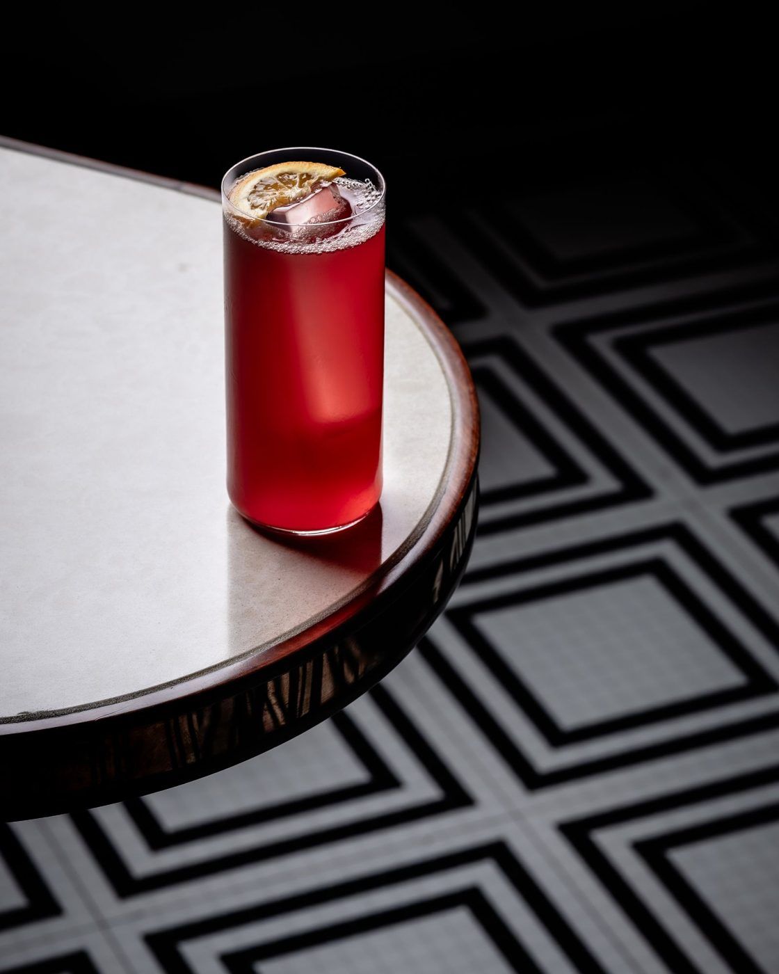 Red highball on a marble table