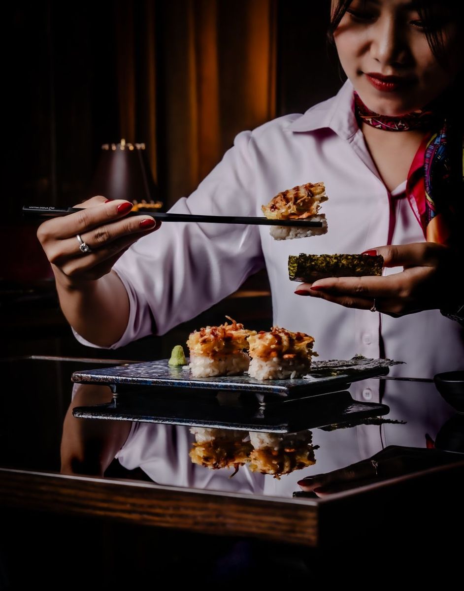 Chopsticks lifting sushi
