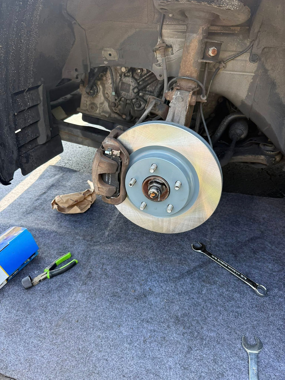Front brake pad and rotor replacement done at customer location by mobile mechanic