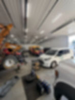 Mobile mechanic performing fleet vehicle maintenance and service for business vehicles on-site