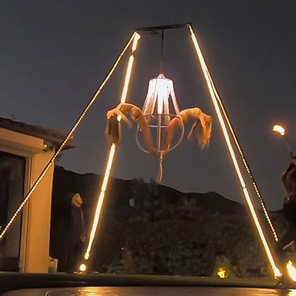Aerial performer on a freestanding rig with chandelier delivering an elegant luxury performance at a corporate event without ceiling rigging