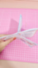 Photo of a mini booklet being folded from paper