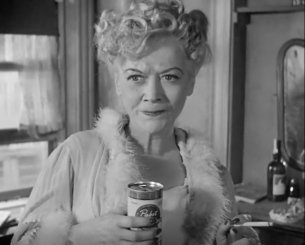 The mean, alcoholic mother of John Garfield in He Ran All The Way grips her favorite slug.