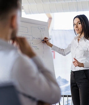 businesswoman-and-businessman-working-with-flip-ch-2022-12-16-22-15-50-utc.jpg