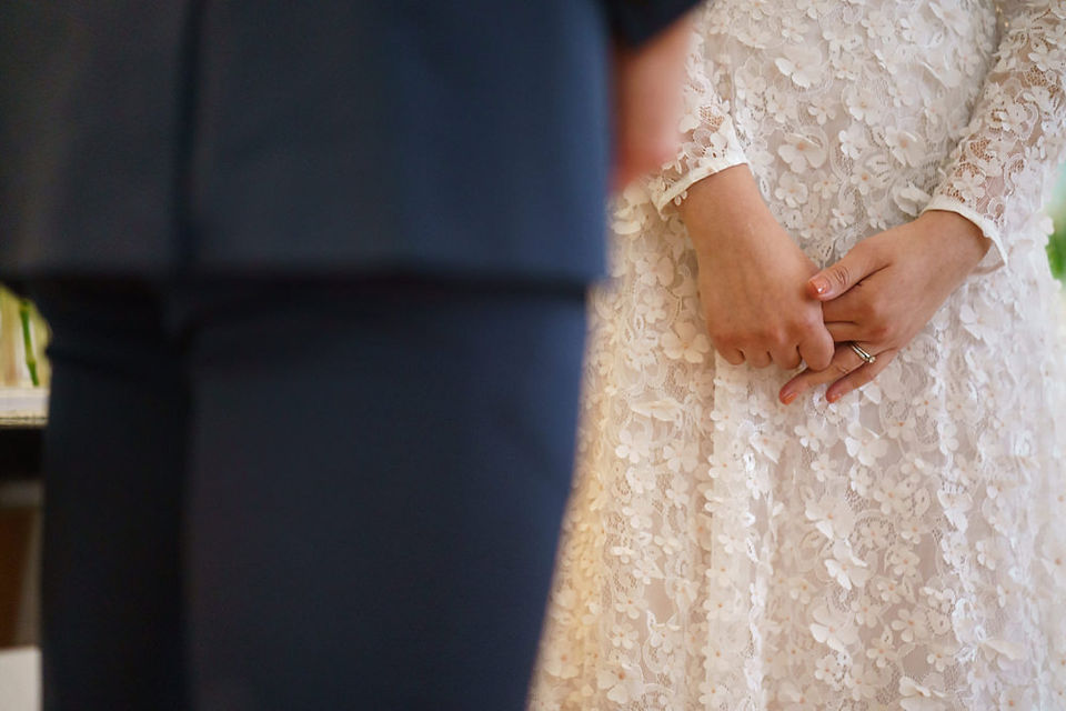 Close-up of bride’s hands during a simple and elegant embassy wedding ceremony in Tokyo Japan