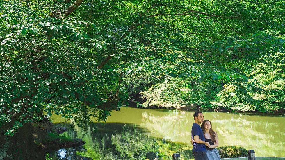 Engagement portrait beside the traditional pond at Shinjuku Gyoen National Garden