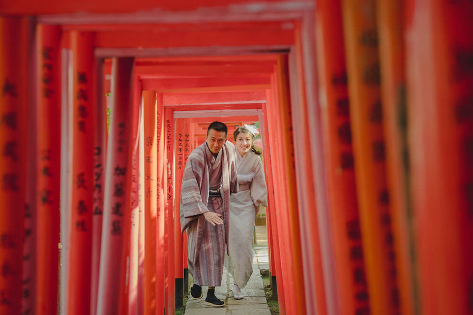 In front of torii gates at Nezu shrine, tokyo