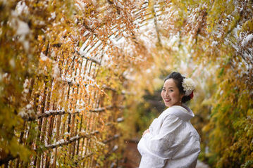 bride at a Japanese garden during red leaves season