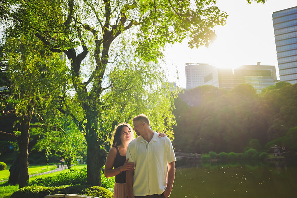 Couple enjoying golden hour after their surprise proposal at Shinjuku Gyoen in Tokyo