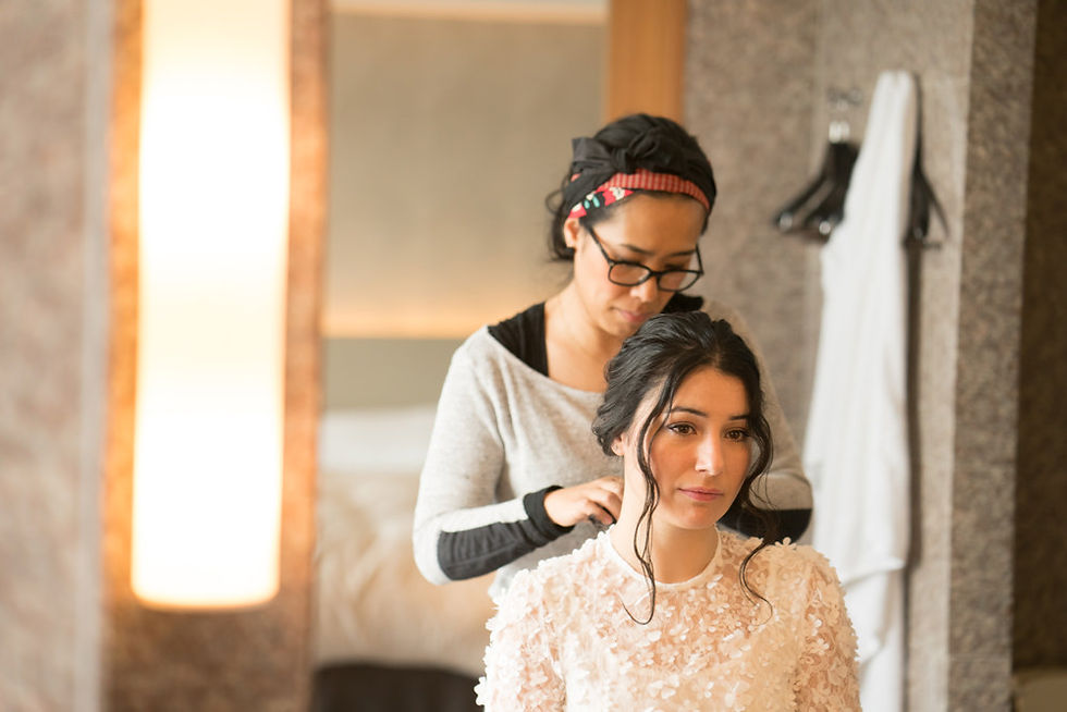 Bride getting her hair styled at a Tokyo hotel before her cherry blossom wedding photography session in Japan
