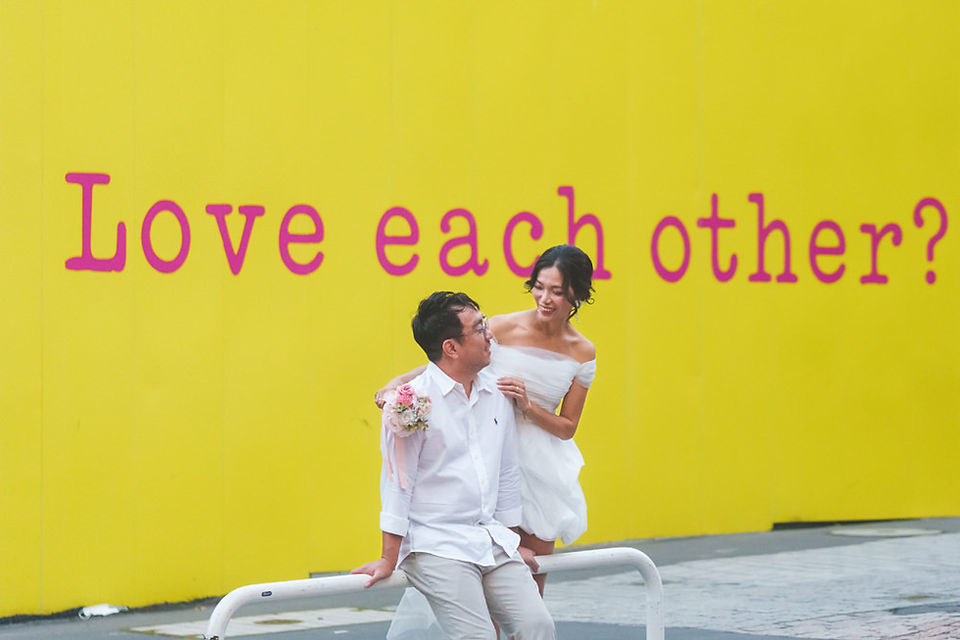 Shibuya engagement photo with an interesting sign